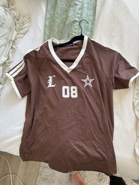 Brown V-Neck Graphic Jersey Tee with White Trim